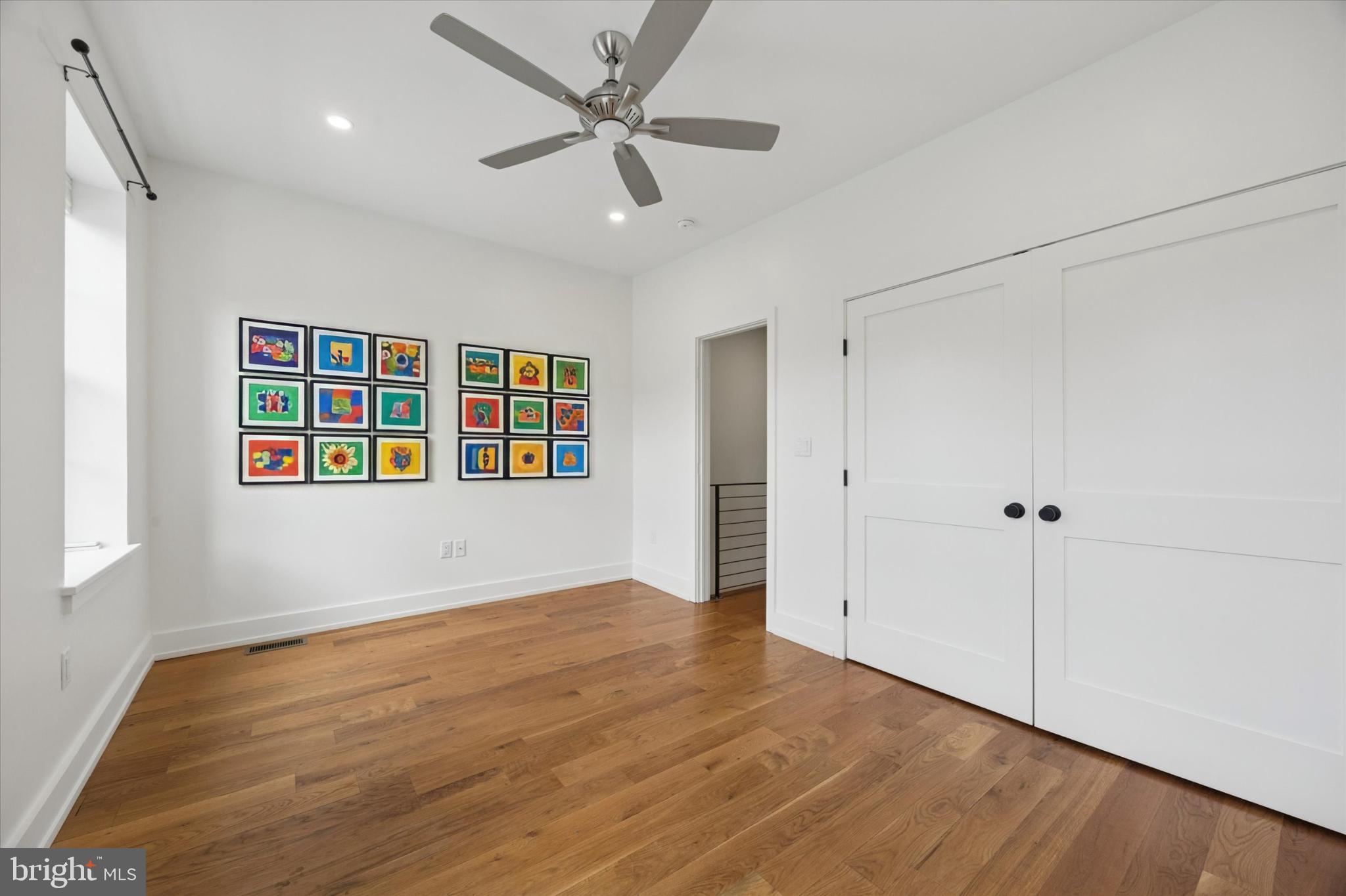 531 Mifflin Street Philadelphia, PA 19148 - Photo 23 of 28 a view of an empty room with a window and wooden floor