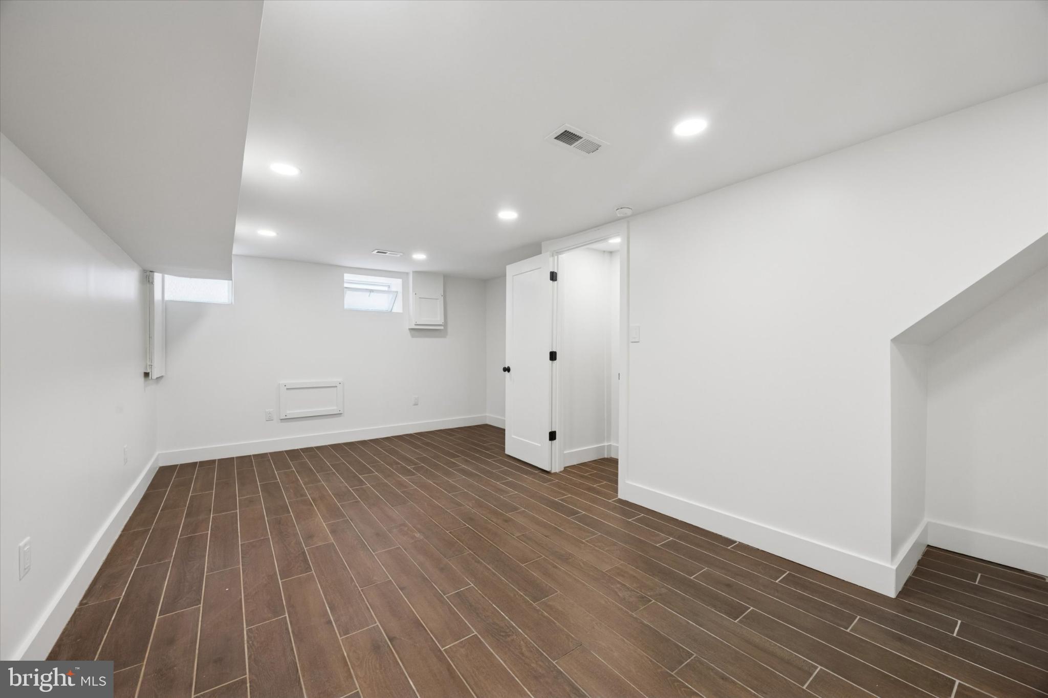531 Mifflin Street Philadelphia, PA 19148 - Photo 27 of 28 a view of an empty room with wooden floor