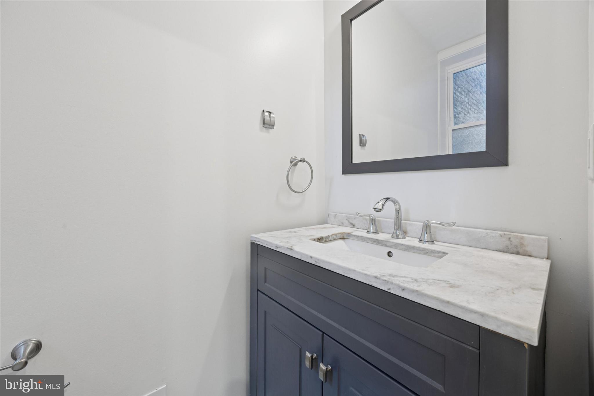 531 Mifflin Street Philadelphia, PA 19148 - Photo 7 of 28 a bathroom with a sink and a mirror