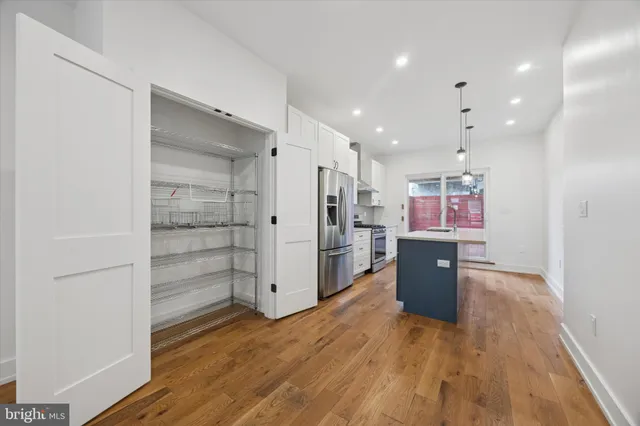 a view of kitchen with wooden floor