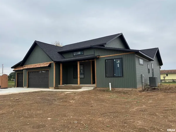 a front view of a house with garage