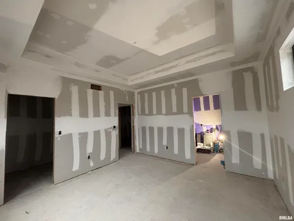 a view of an empty room with a fireplace