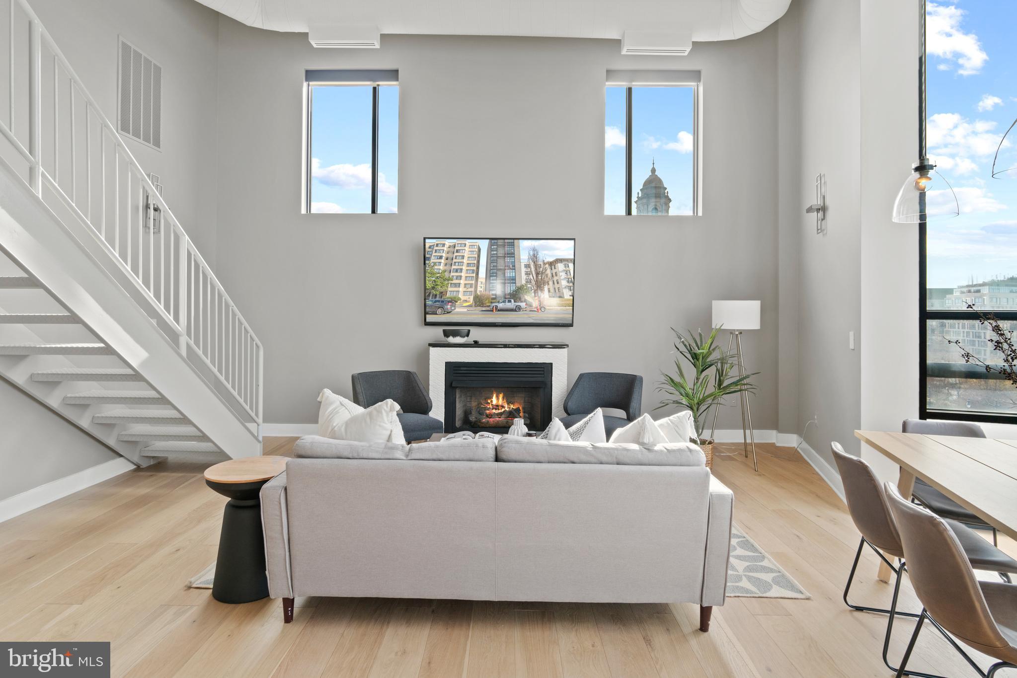 3039 16th Street Northwest, Unit 401 Washington, DC 20009 - Photo 4 of 25 Living area with gas fireplace