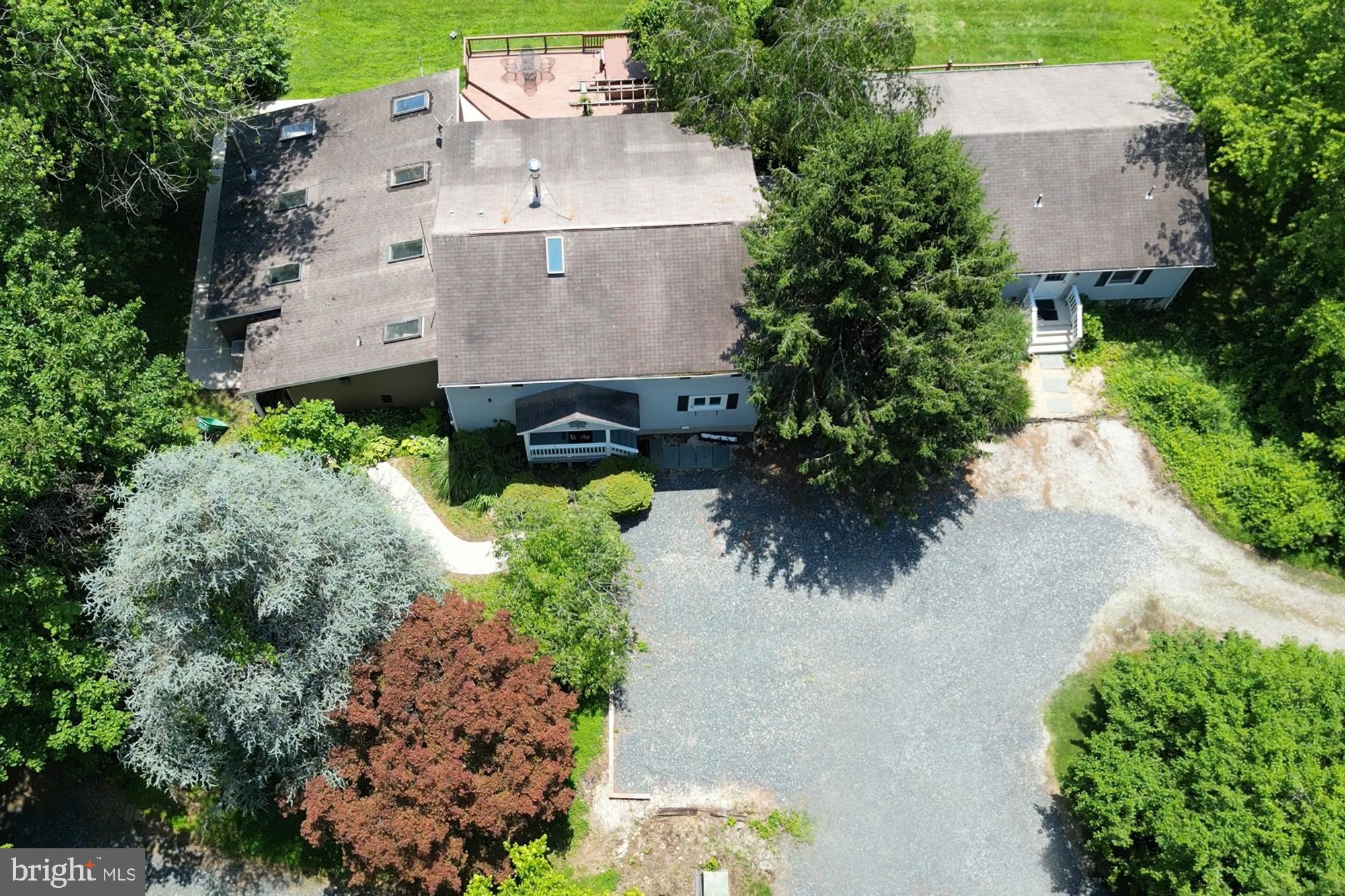 4441 Solomons Island Road Harwood, MD 20776 - Photo 13 of 87 an aerial view of a house with a yard and garden