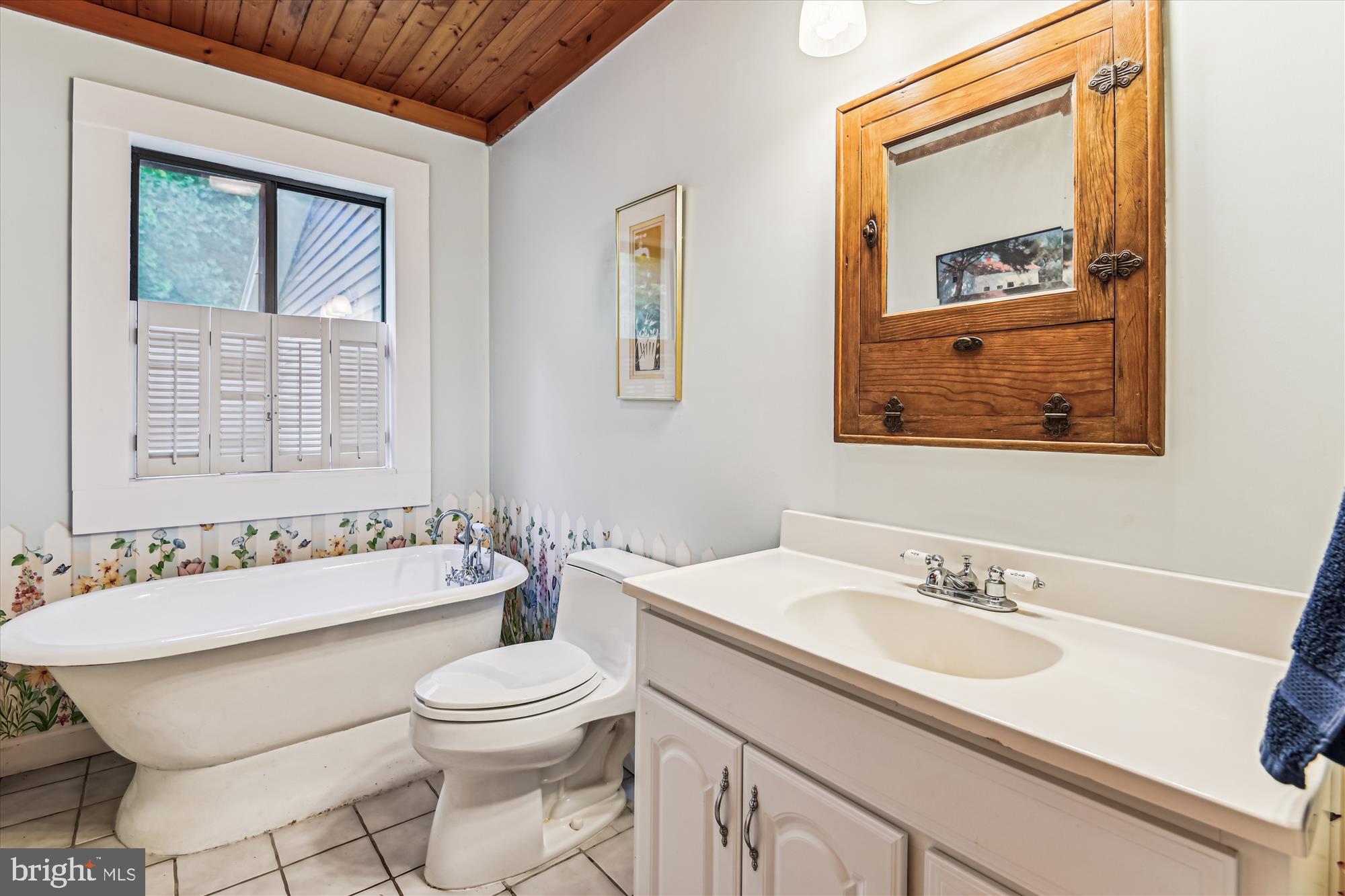 4441 Solomons Island Road Harwood, MD 20776 - Photo 17 of 87 a bathroom with a sink and a mirror