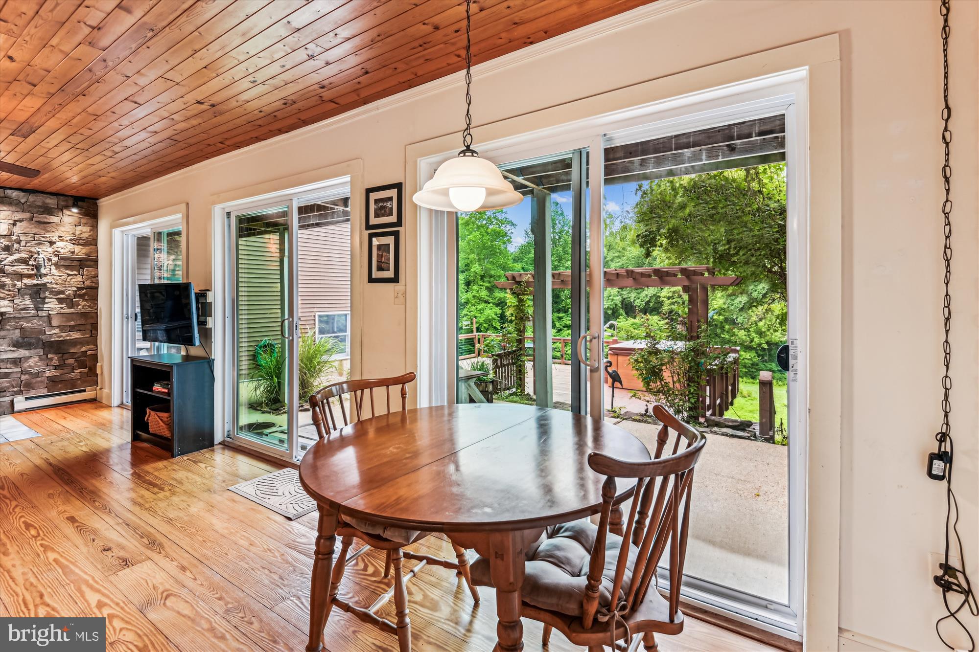 4441 Solomons Island Road Harwood, MD 20776 - Photo 22 of 87 a view of a dining room with furniture window and wooden floor