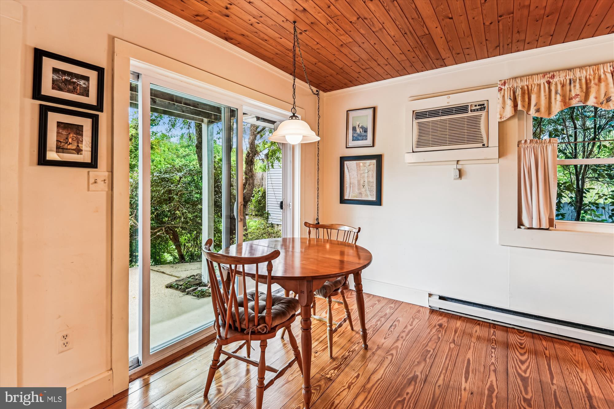 4441 Solomons Island Road Harwood, MD 20776 - Photo 23 of 87 a view of a dining room with furniture window and wooden floor