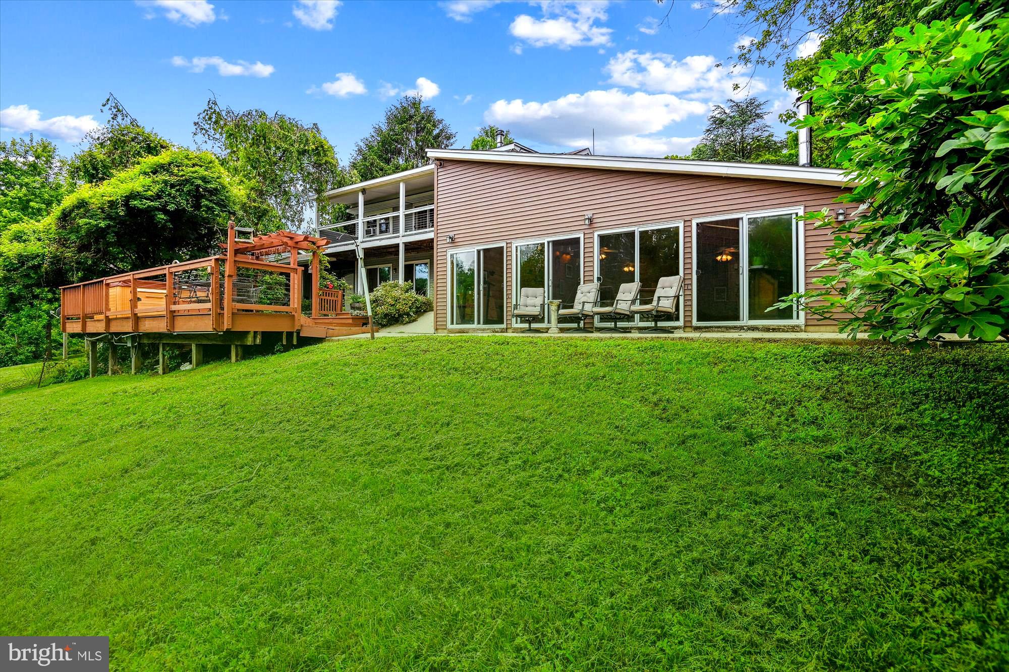 4441 Solomons Island Road Harwood, MD 20776 - Photo 24 of 87 a front view of a house with a yard