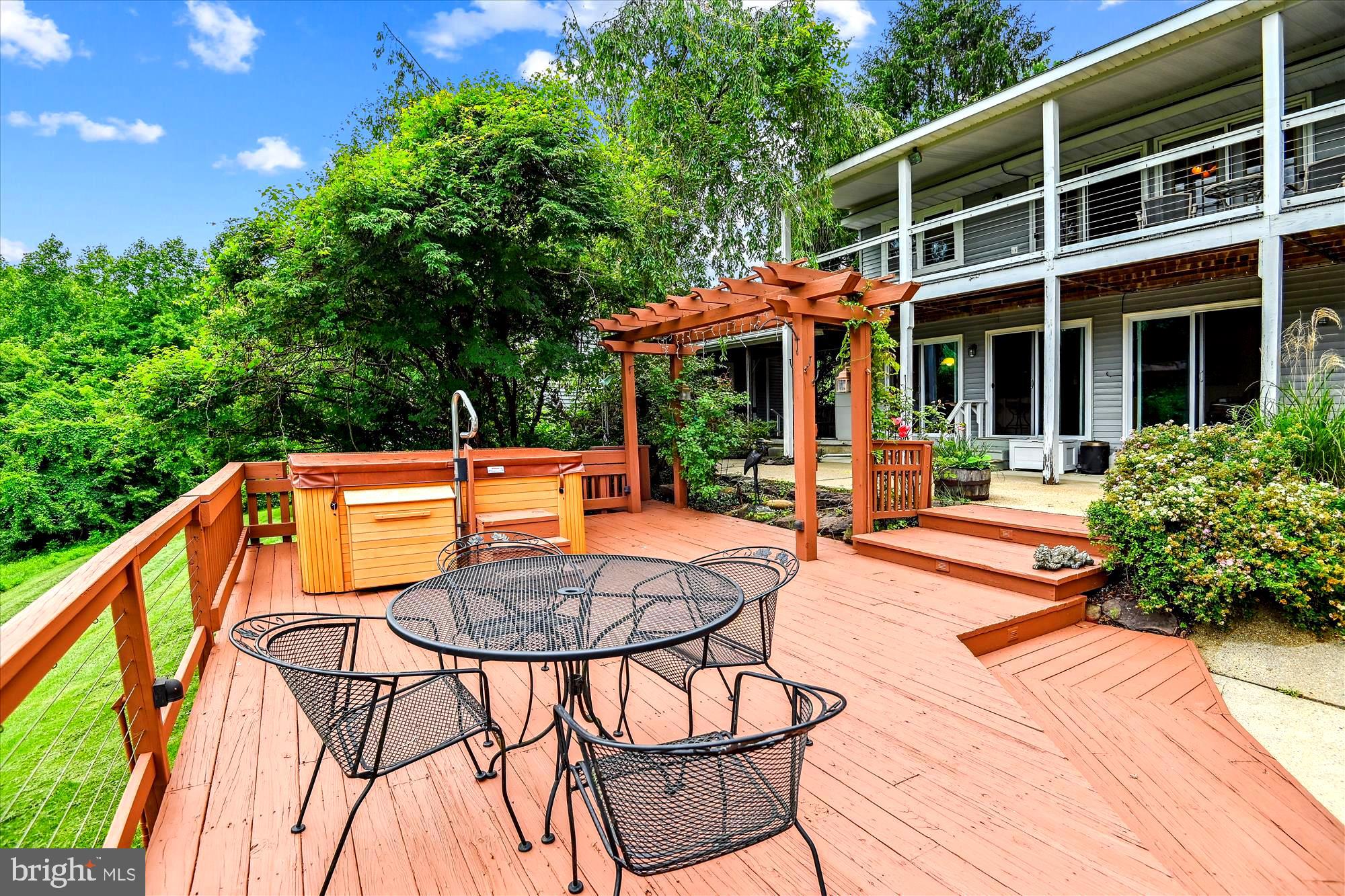 4441 Solomons Island Road Harwood, MD 20776 - Photo 26 of 87 a backyard of a house with basket ball court tables and chairs