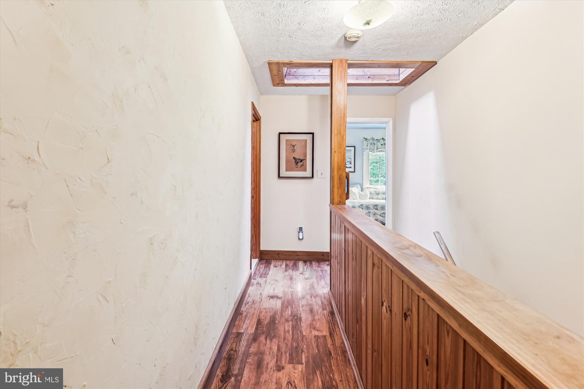 4441 Solomons Island Road Harwood, MD 20776 - Photo 45 of 87 a view of a hallway with wooden floor and staircase