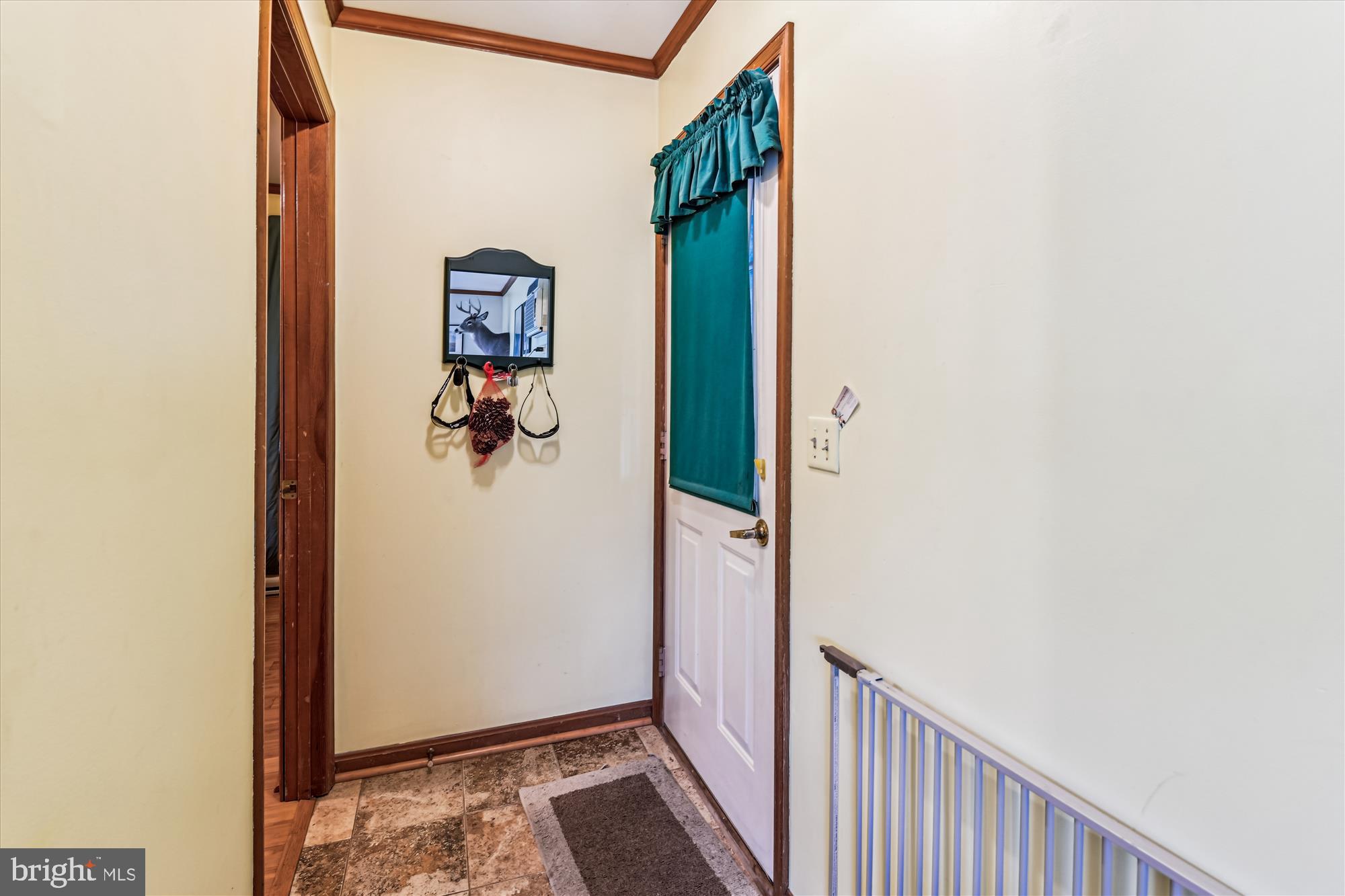 4441 Solomons Island Road Harwood, MD 20776 - Photo 61 of 87 a view of a hallway with wooden floor and closet