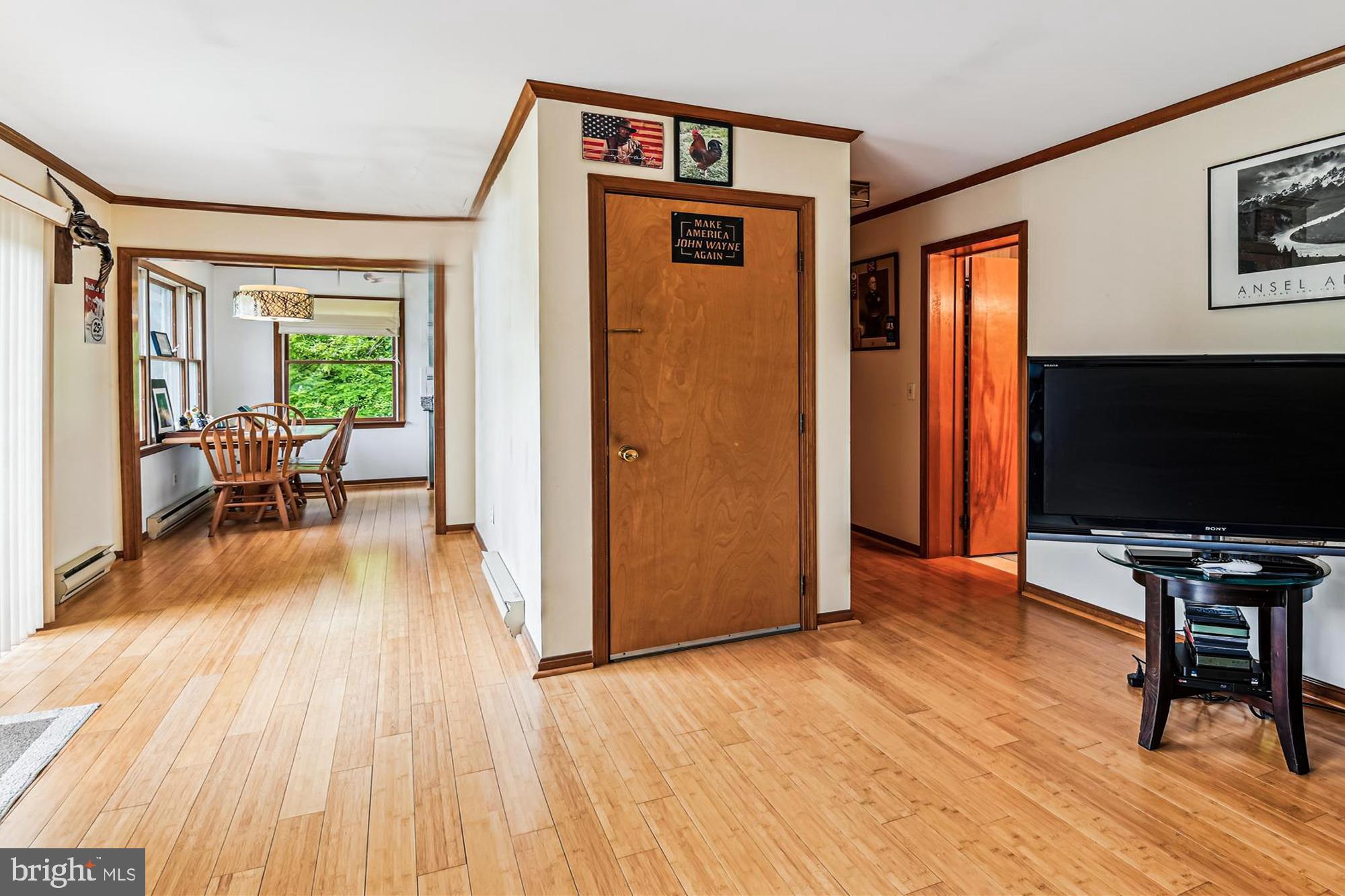 4441 Solomons Island Road Harwood, MD 20776 - Photo 66 of 87 a view of a livingroom with furniture hardwood floor and a flat screen tv