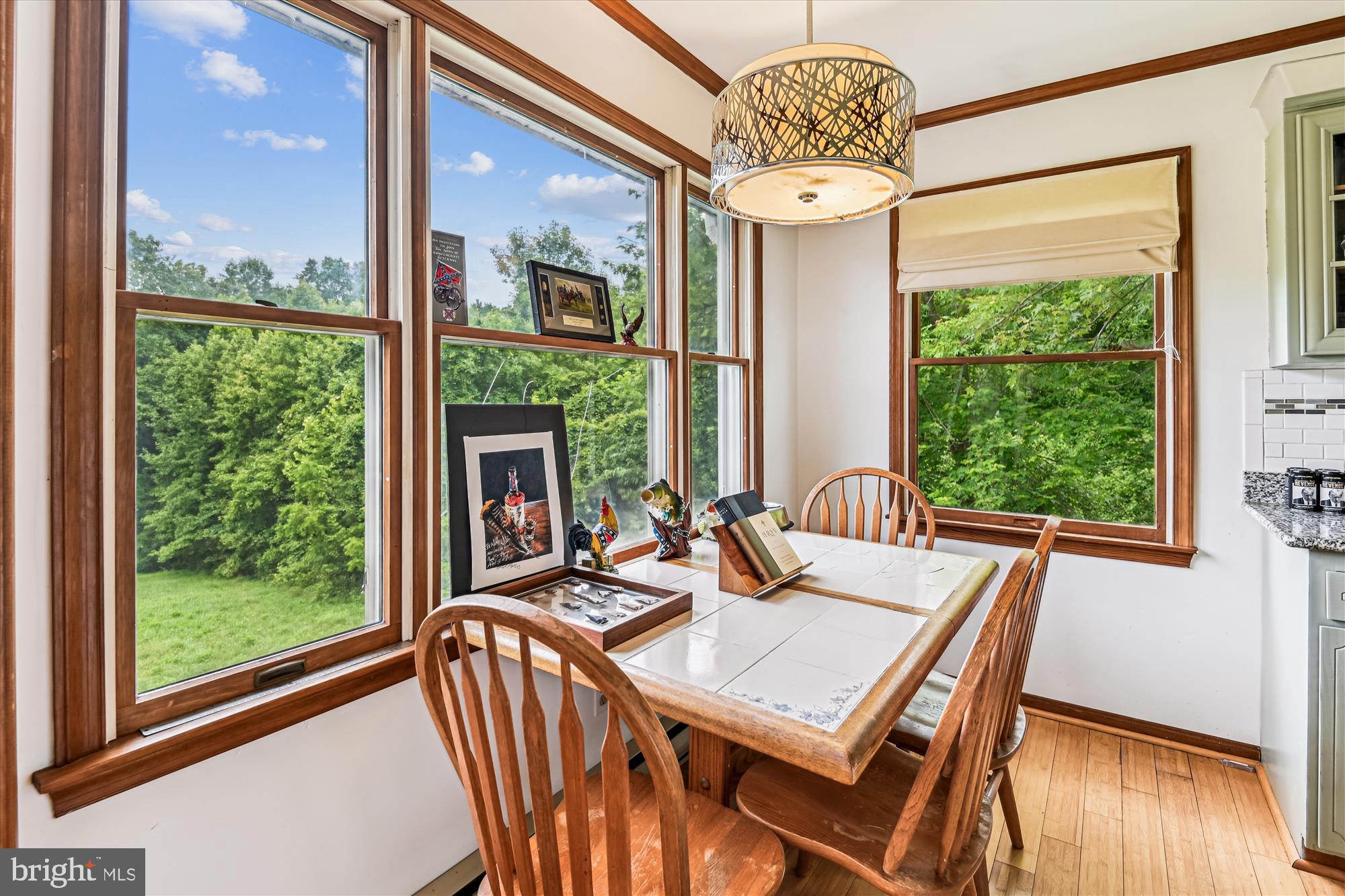 4441 Solomons Island Road Harwood, MD 20776 - Photo 67 of 87 a view of a dining room with furniture a chandelier and wooden floor