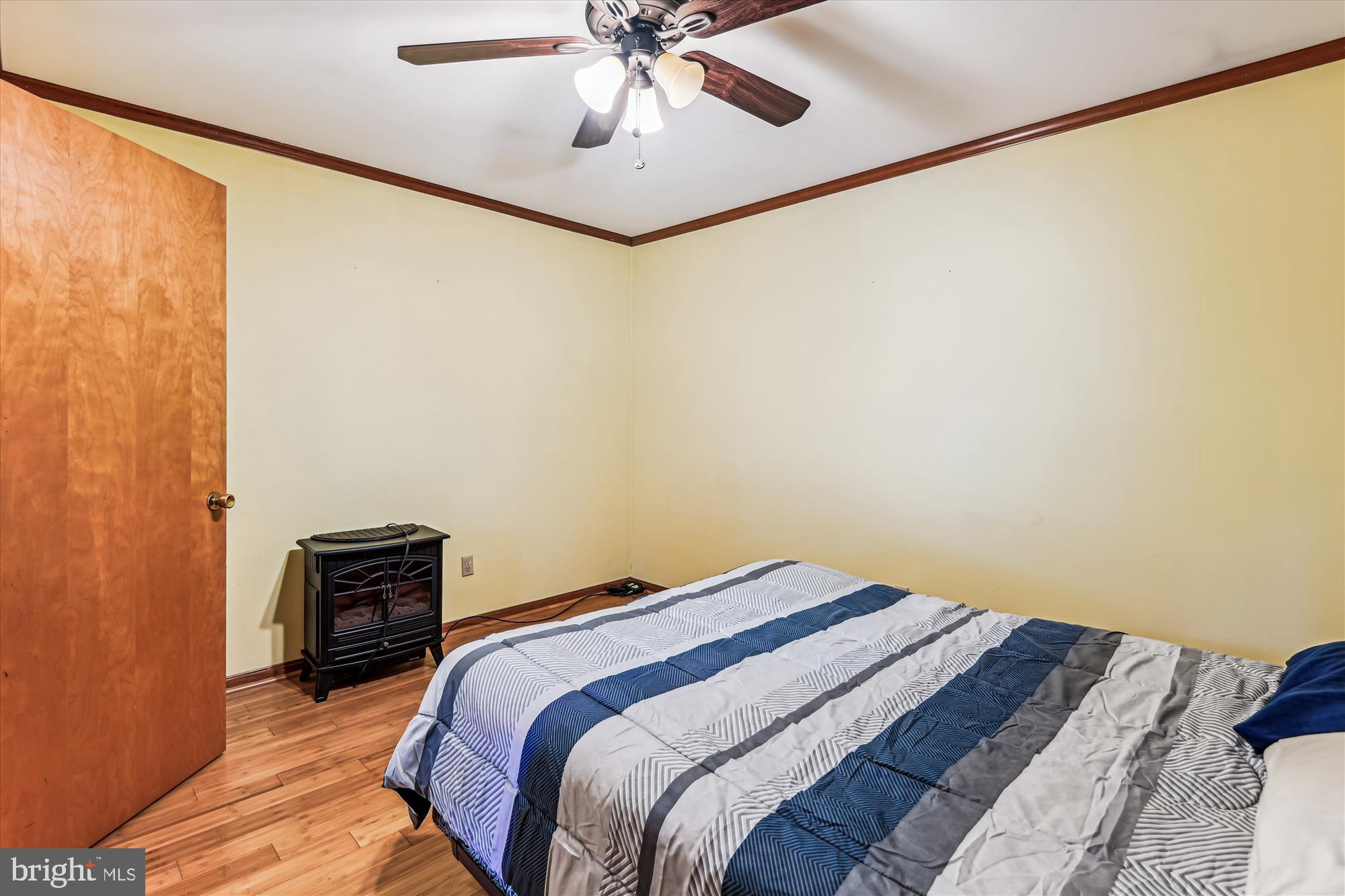 4441 Solomons Island Road Harwood, MD 20776 - Photo 73 of 87 a bedroom with a bed and a ceiling fan