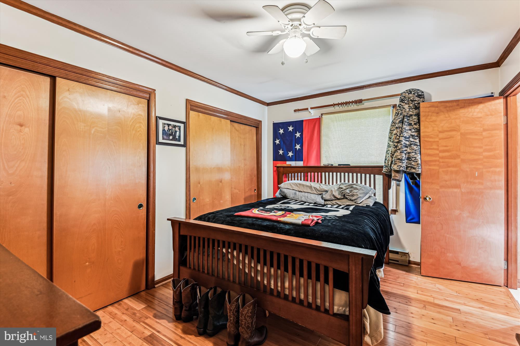 4441 Solomons Island Road Harwood, MD 20776 - Photo 75 of 87 a bedroom with furniture window and wooden floor