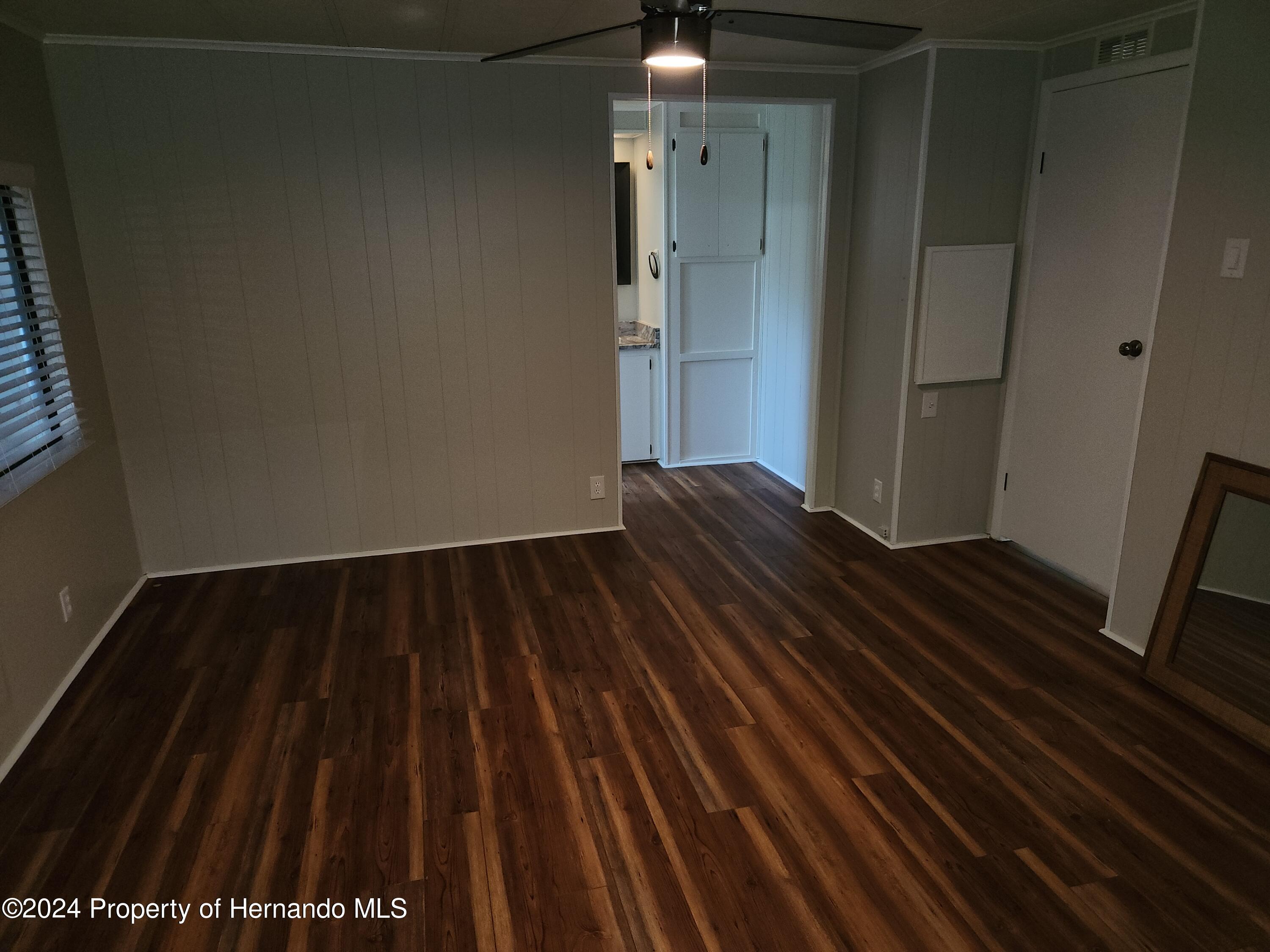 8040 Mission Street Brooksville, FL 34613 - Photo 14 of 17 a view of wooden floor