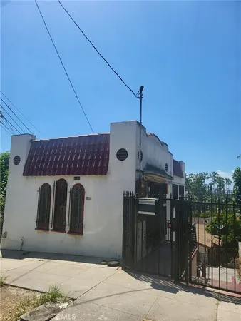 a front view of a house with parking