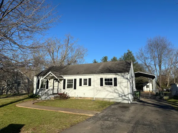 front view of a house with a yard
