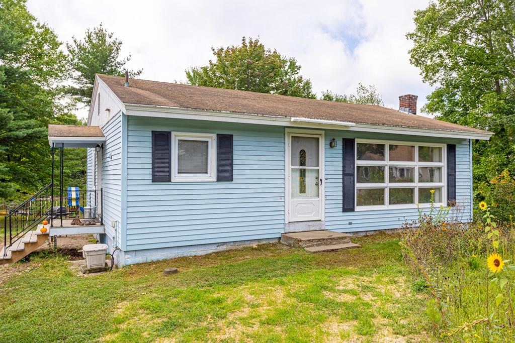 202 Whalom Road Lunenburg, MA 01462 - Photo 1 of 42 a front view of a house with a yard