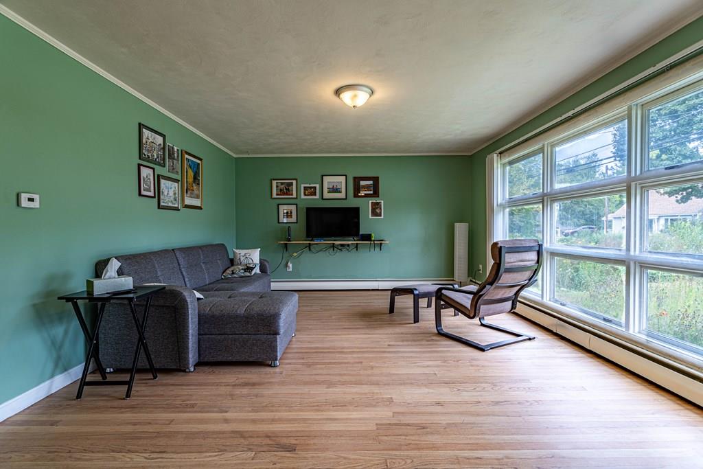 202 Whalom Road Lunenburg, MA 01462 - Photo 12 of 42 a living room with furniture and a flat screen tv