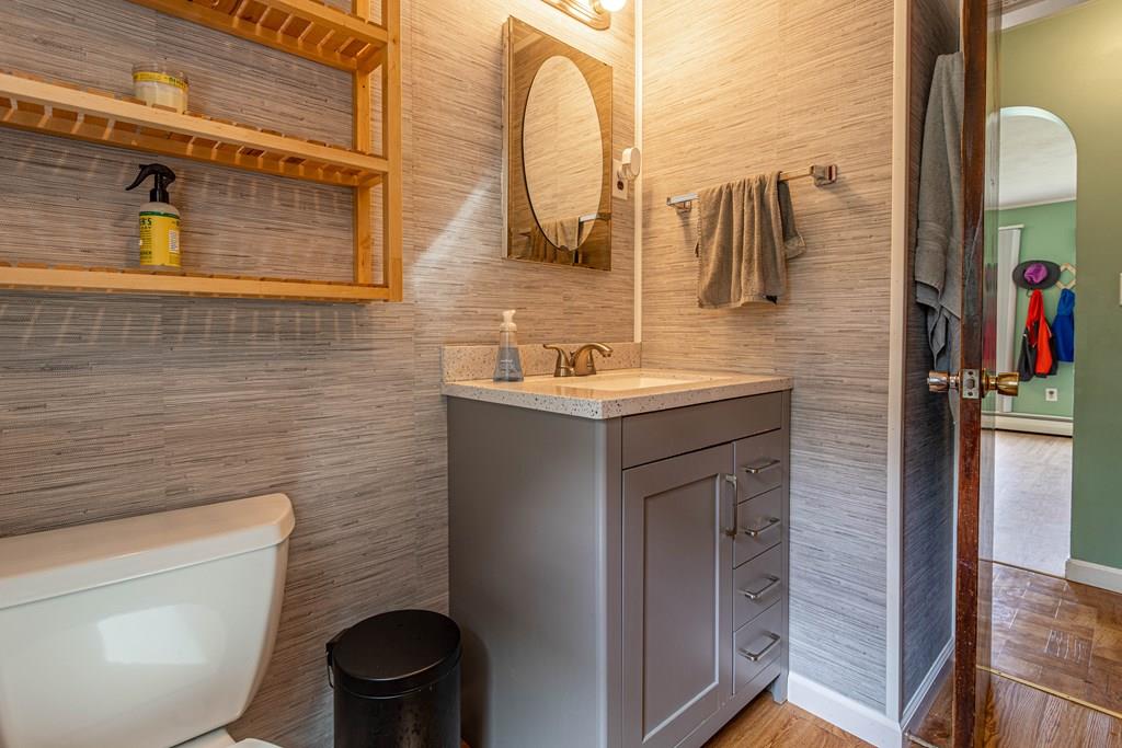 202 Whalom Road Lunenburg, MA 01462 - Photo 16 of 42 a bathroom with a sink a toilet and mirror