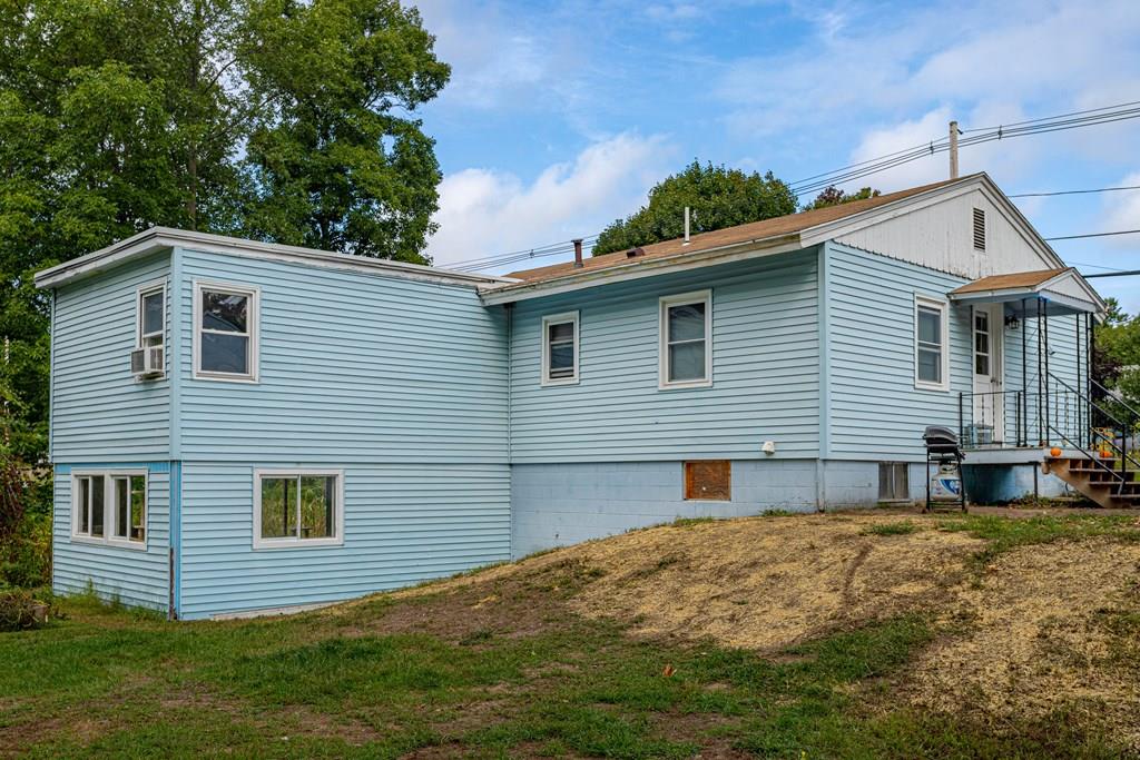 202 Whalom Road Lunenburg, MA 01462 - Photo 2 of 42 a front view of a house with a yard