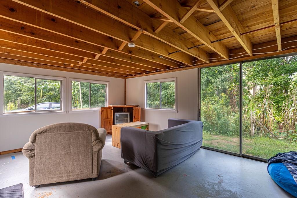 202 Whalom Road Lunenburg, MA 01462 - Photo 25 of 42 a living room with furniture and a backyard