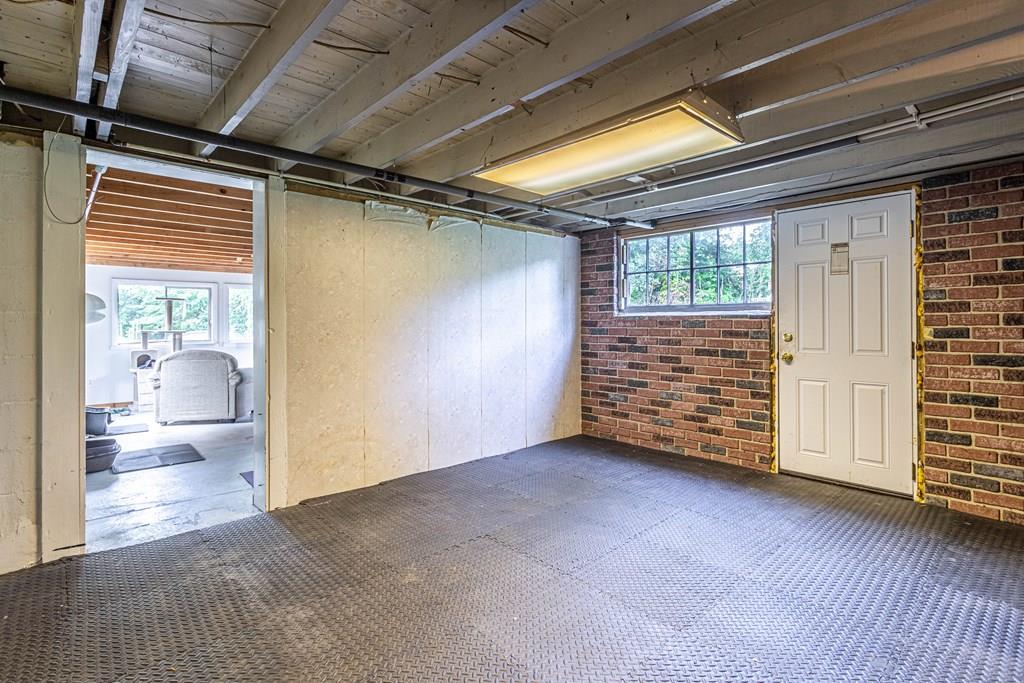 202 Whalom Road Lunenburg, MA 01462 - Photo 27 of 42 a view of an empty room with wooden floor
