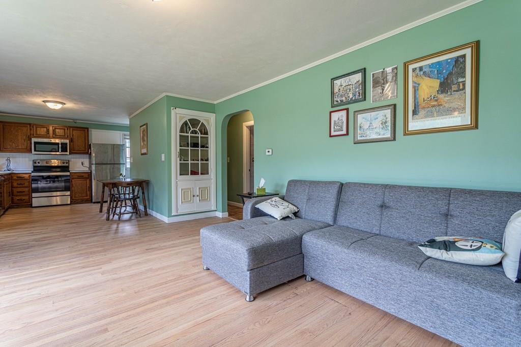 202 Whalom Road Lunenburg, MA 01462 - Photo 3 of 42 a living room with furniture and a wooden floor