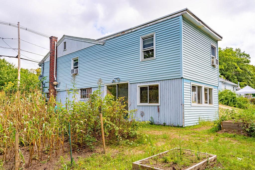 202 Whalom Road Lunenburg, MA 01462 - Photo 40 of 42 a view of a house with a yard