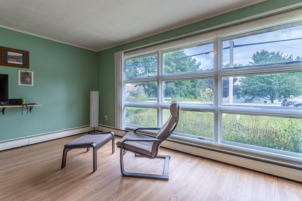 202 Whalom Road Lunenburg, MA 01462 - Photo 5 of 42 a living room with furniture and windows