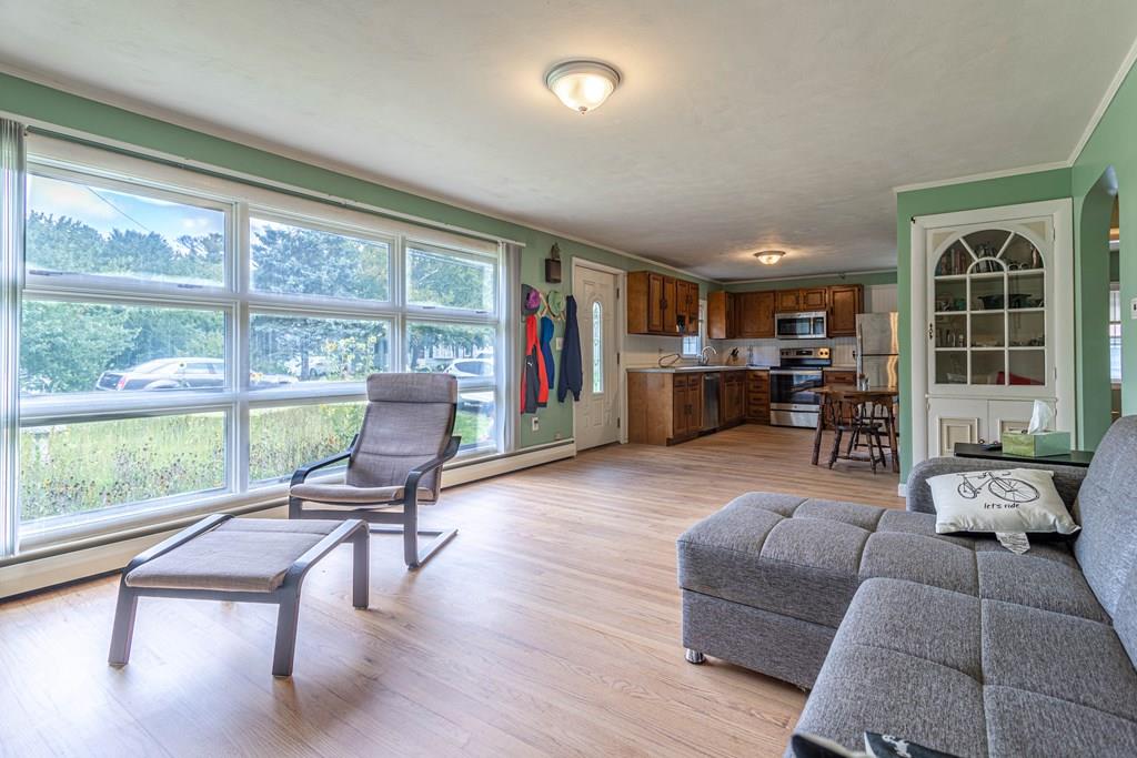 202 Whalom Road Lunenburg, MA 01462 - Photo 6 of 42 a living room with furniture and large window