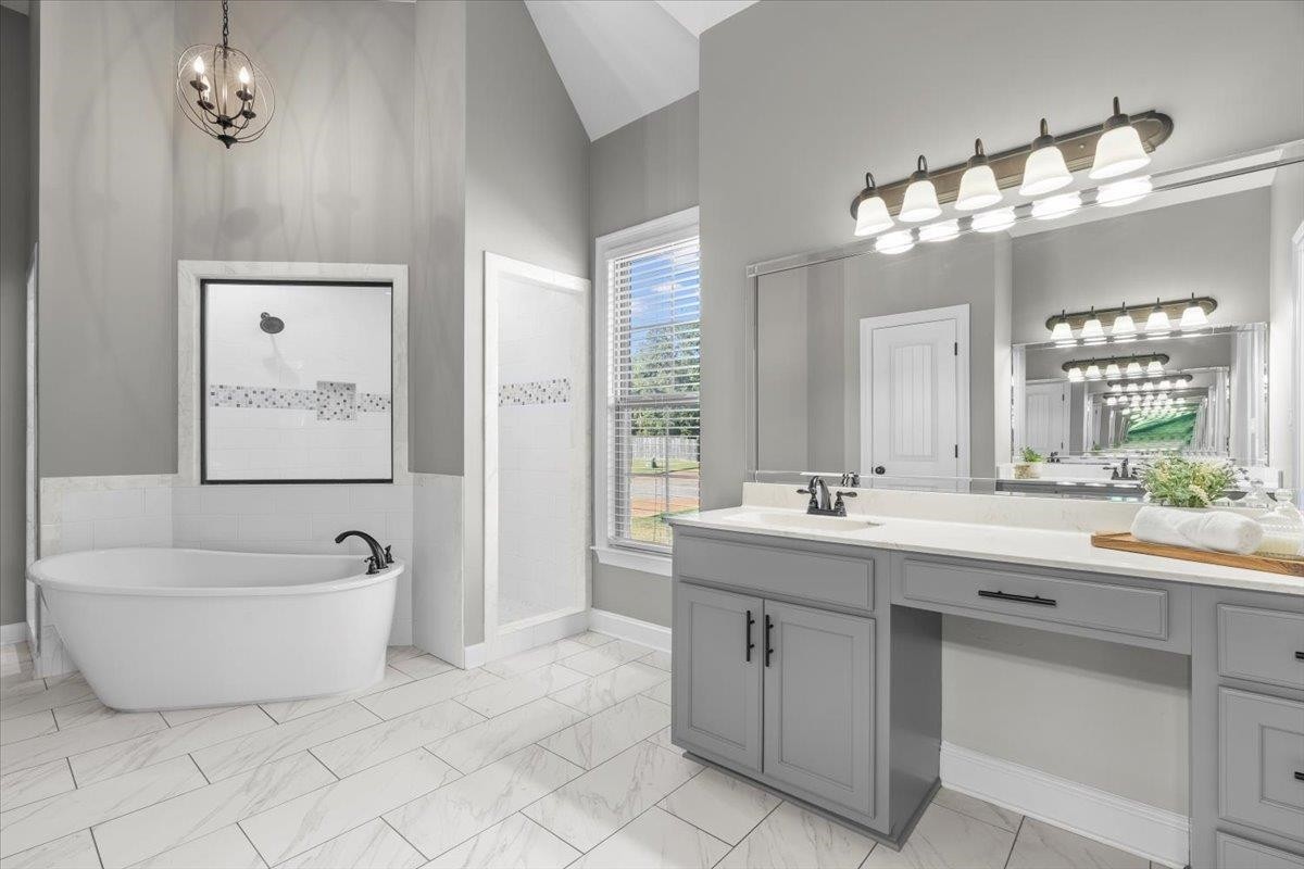 1739 Treestand Road Southaven, MS 38672 - Photo 12 of 27 a spacious bathroom with a double vanity sink mirror and bathtub