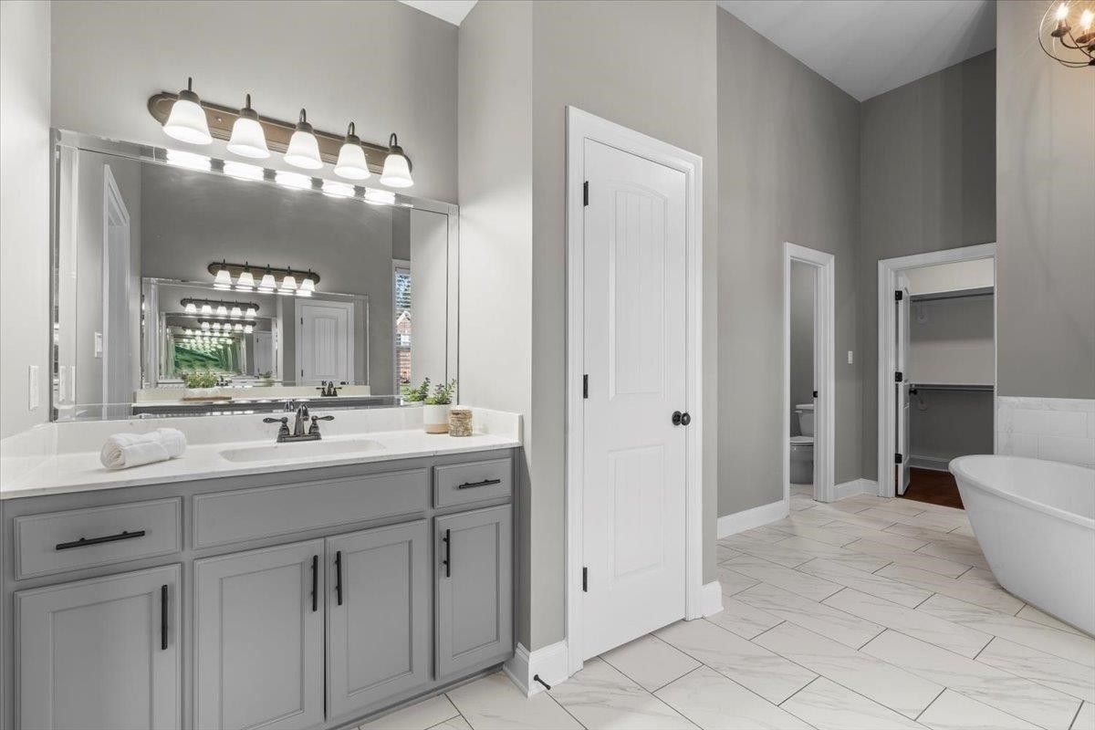 1739 Treestand Road Southaven, MS 38672 - Photo 13 of 27 a bathroom with a sink vanity and a mirror