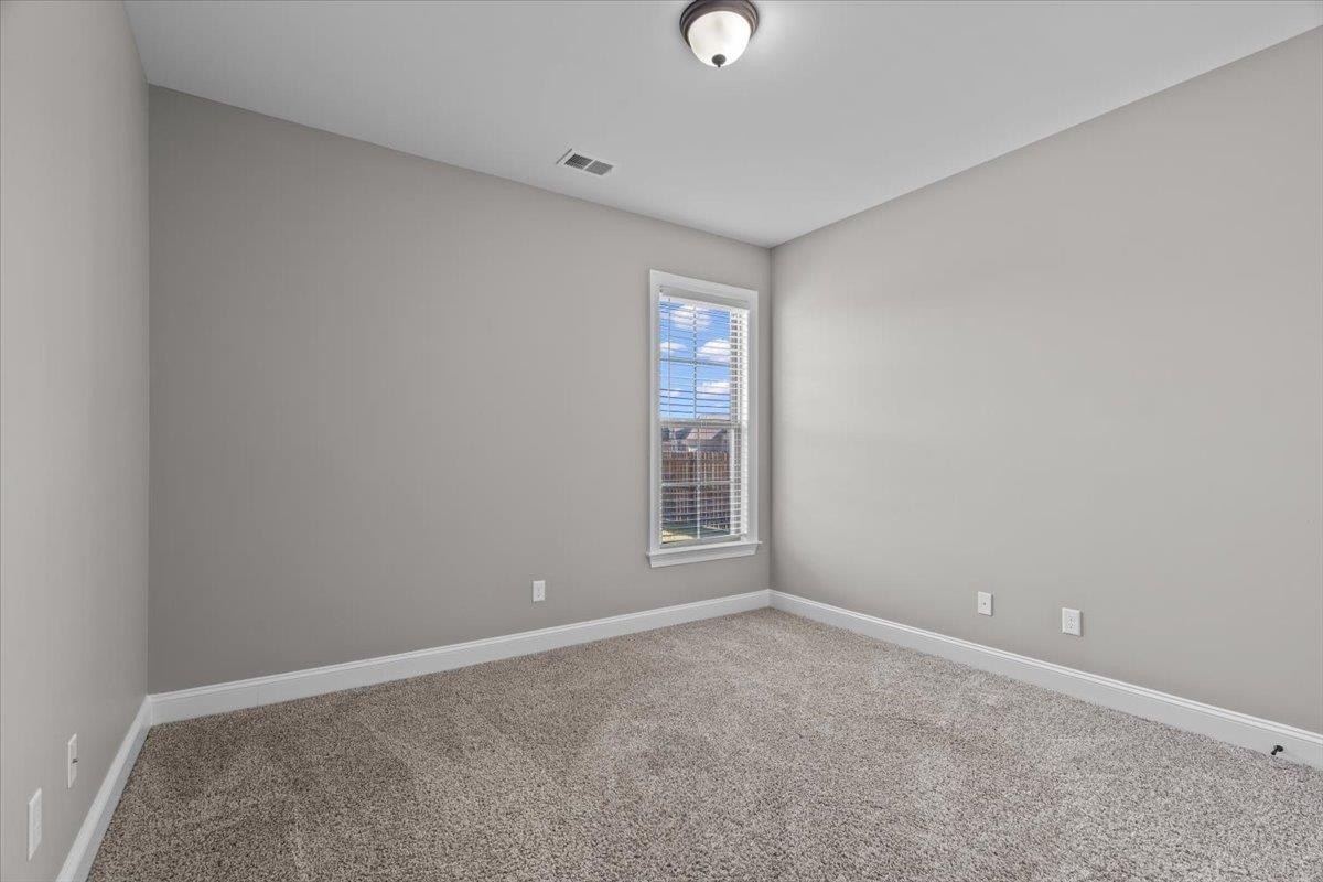 1739 Treestand Road Southaven, MS 38672 - Photo 16 of 27 a view of an empty room with a window