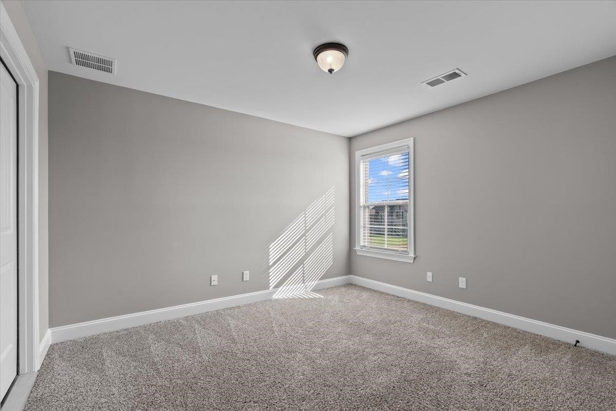 1739 Treestand Road Southaven, MS 38672 - Photo 18 of 27 a view of an empty room with a window