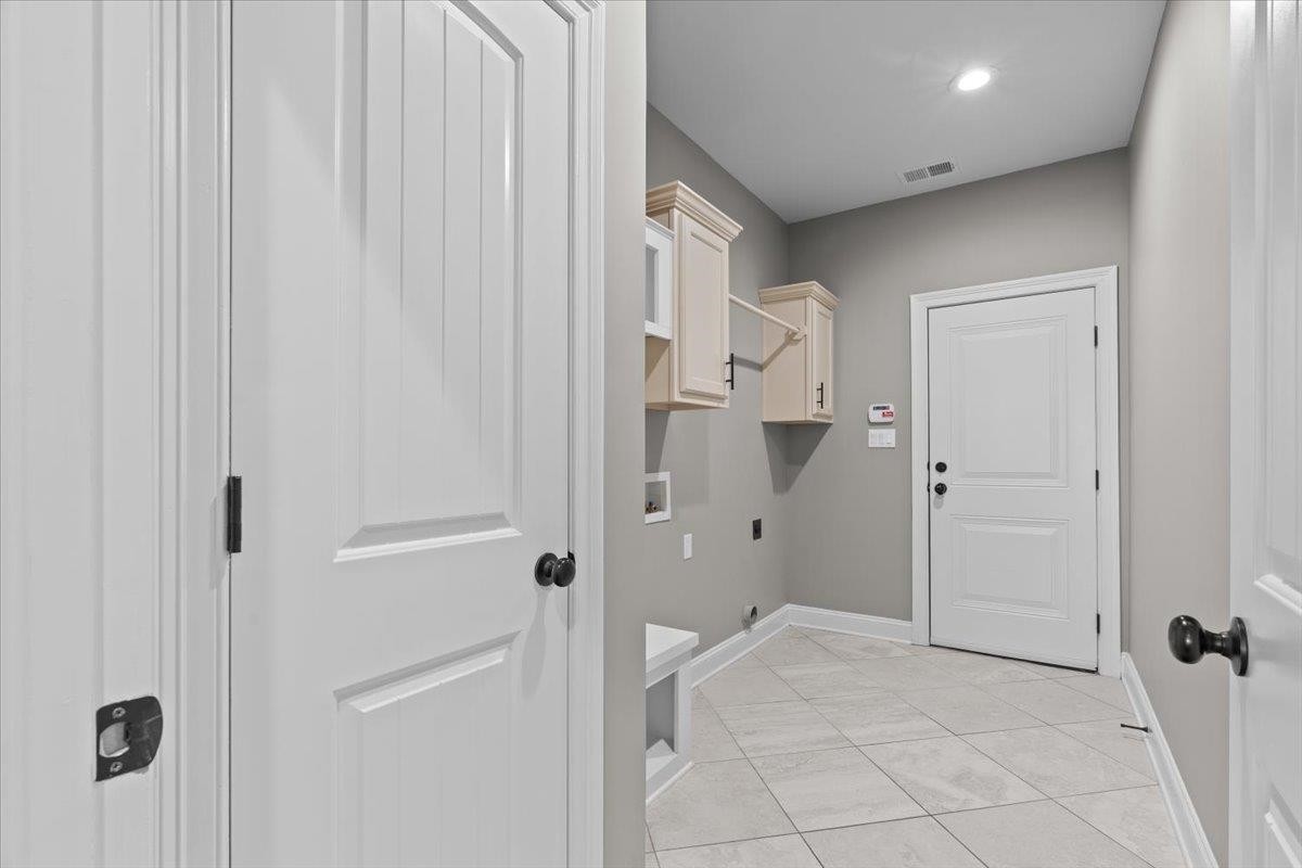 1739 Treestand Road Southaven, MS 38672 - Photo 21 of 27 a view of a bathroom with a shower and a sink