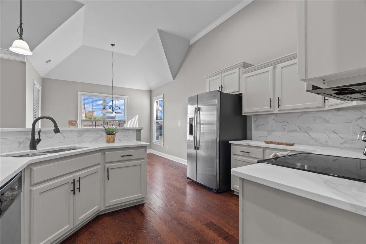 1739 Treestand Road Southaven, MS 38672 - Photo 6 of 27 a kitchen with white cabinets and stainless steel appliances
