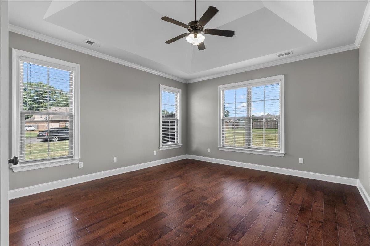 1739 Treestand Road Southaven, MS 38672 - Photo 9 of 27 a view of an empty room with wooden floor and a window