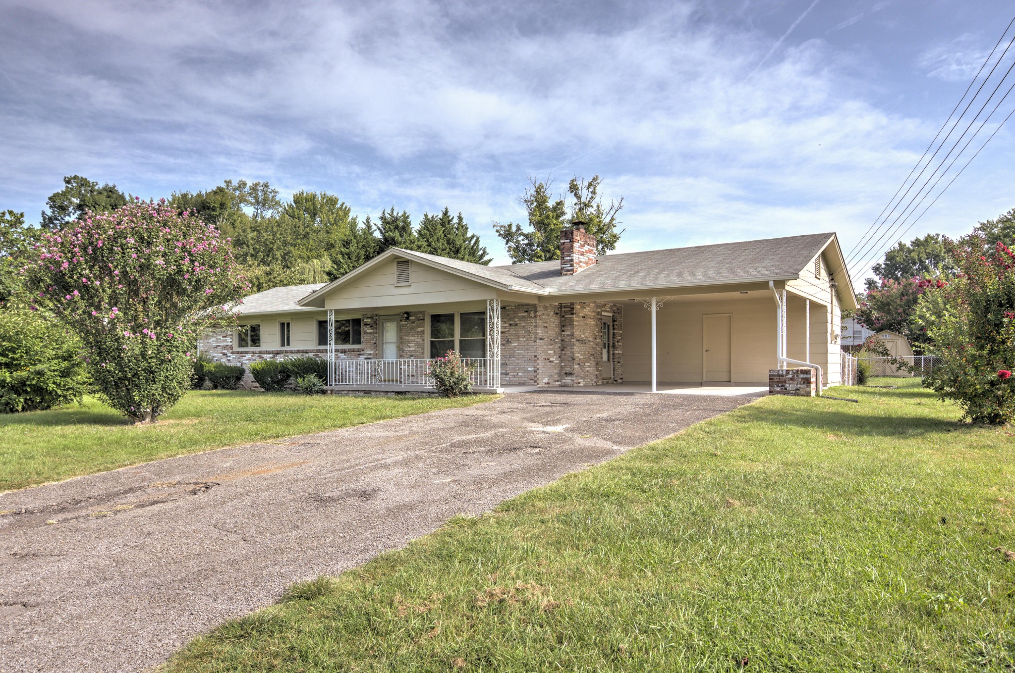 4309 Royalview Road Knoxville, TN 37921 - Photo 1 of 29 a front view of a house with a yard and garage