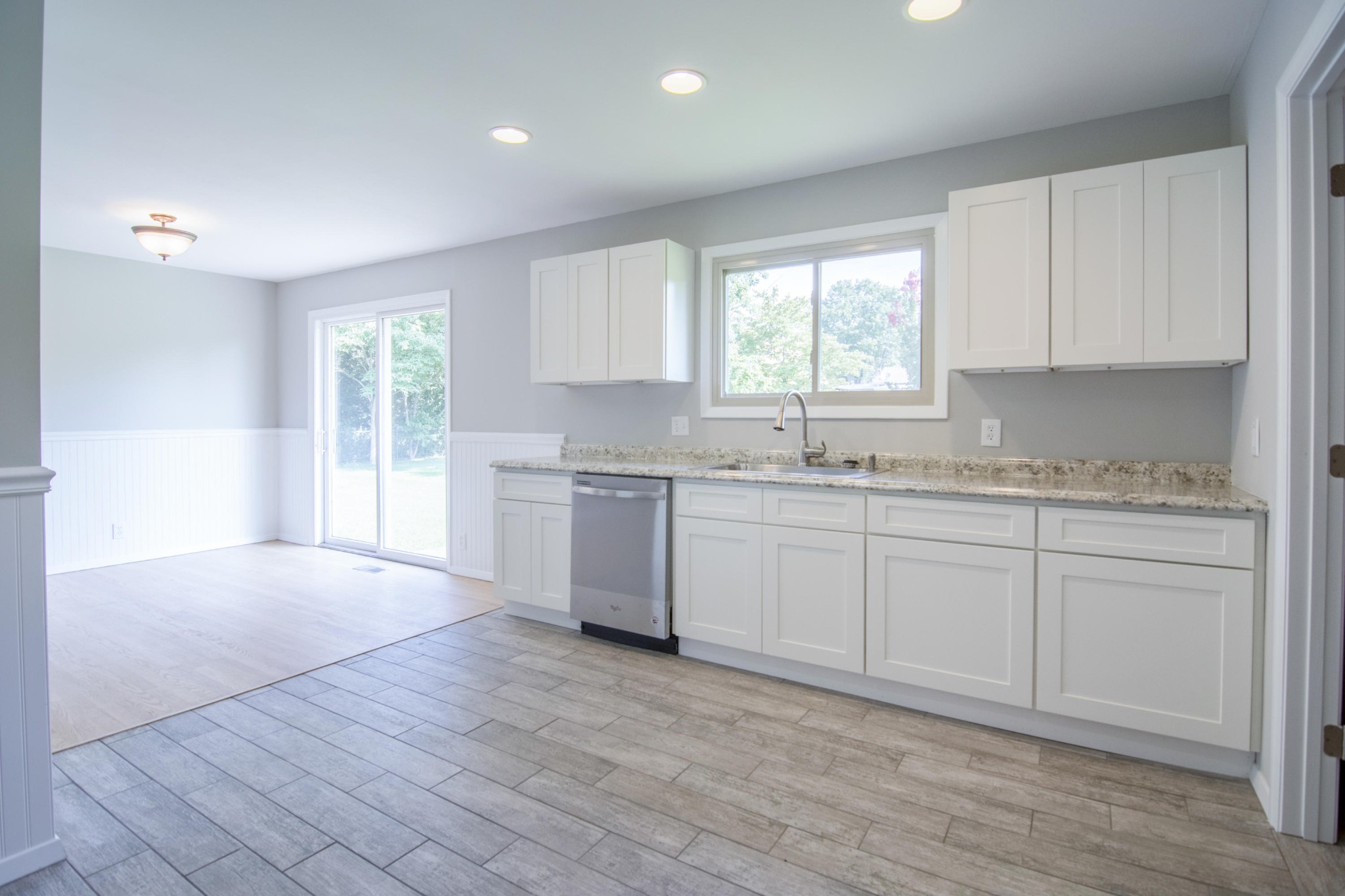 4309 Royalview Road Knoxville, TN 37921 - Photo 11 of 29 a kitchen with granite countertop white cabinets and white appliances
