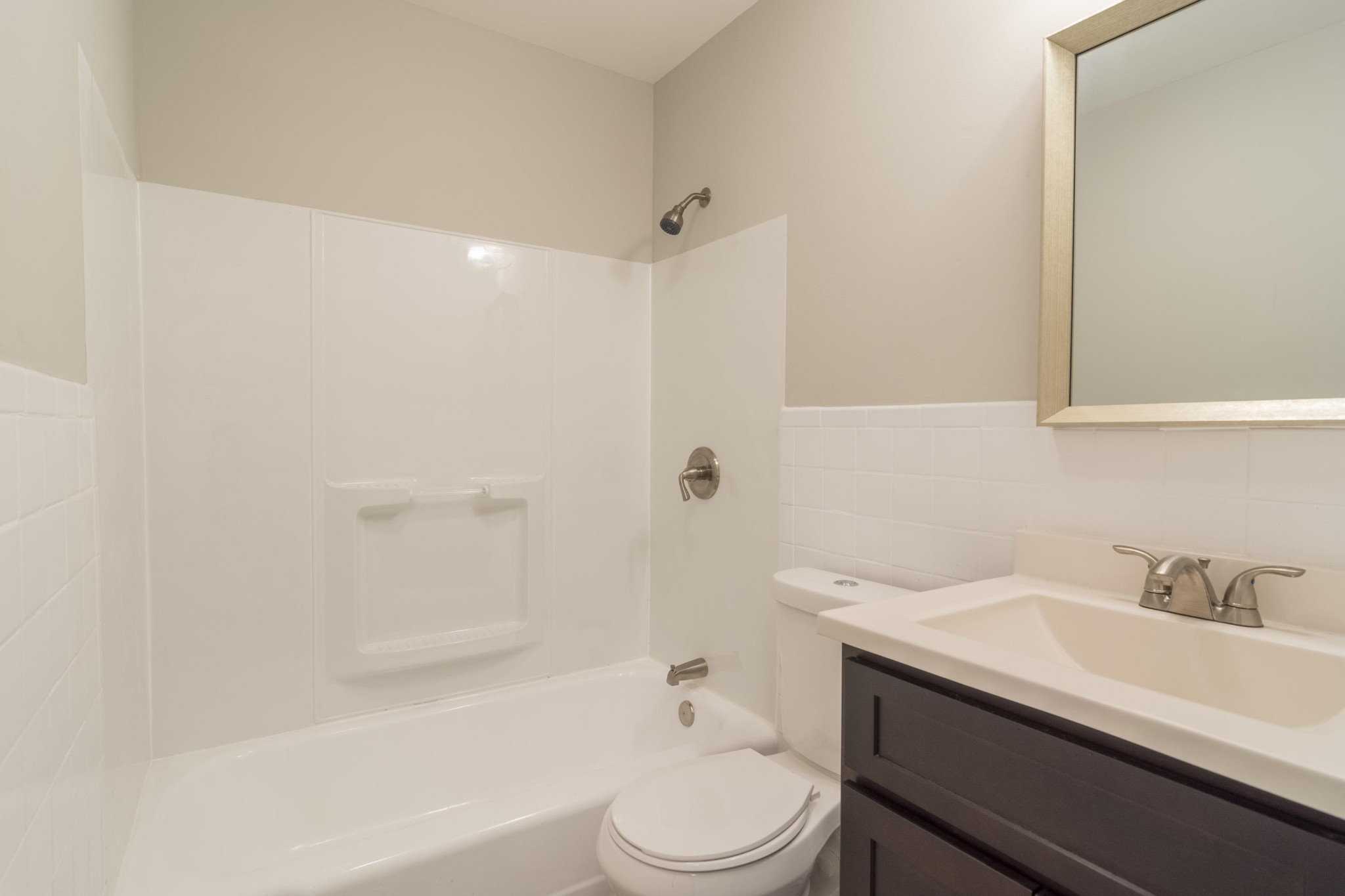 4309 Royalview Road Knoxville, TN 37921 - Photo 19 of 29 a bathroom with a sink a toilet and shower