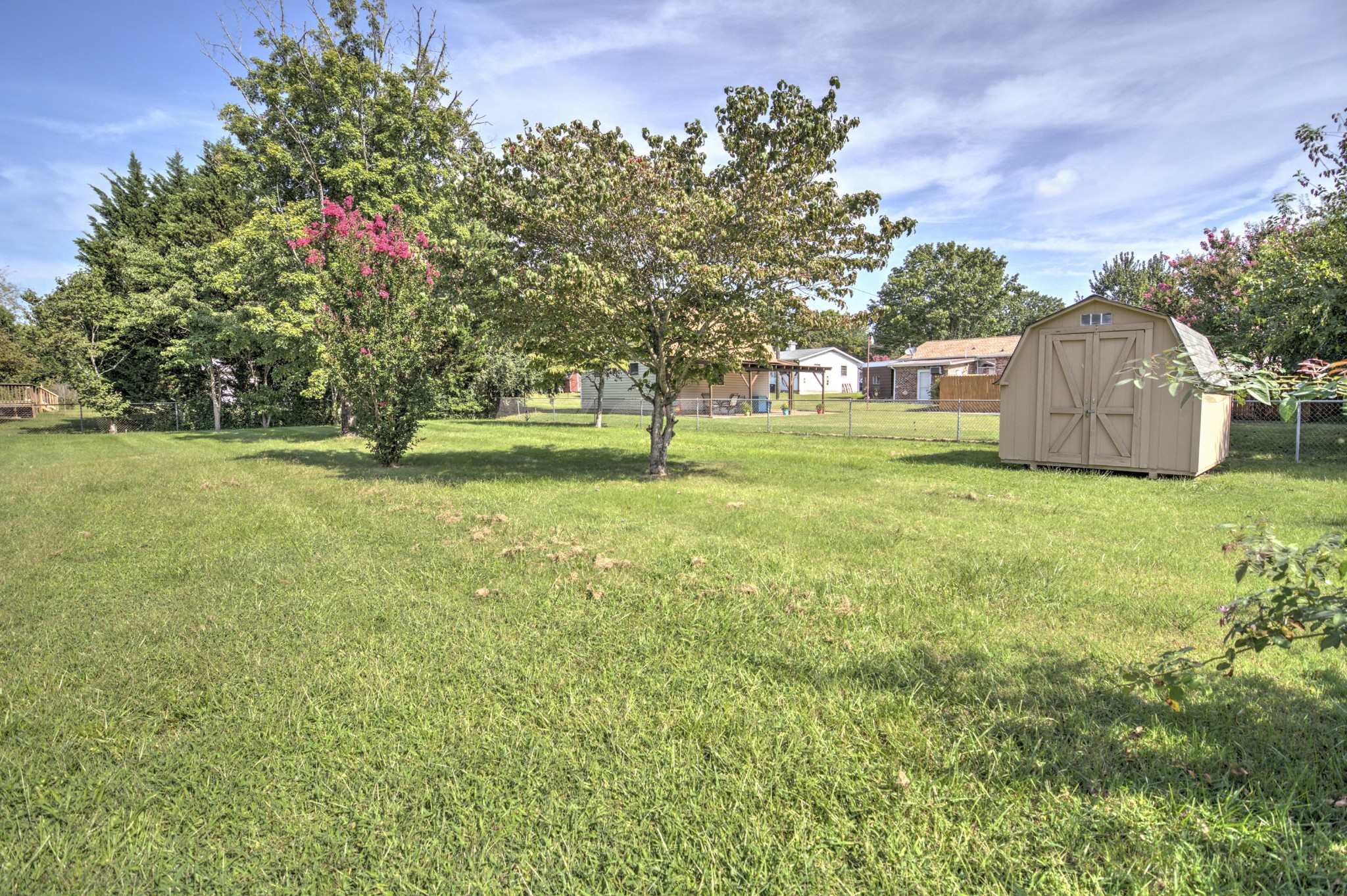 4309 Royalview Road Knoxville, TN 37921 - Photo 29 of 29 a garden with trees in the background