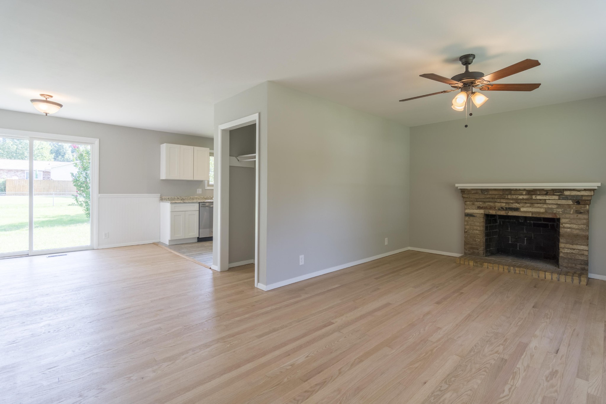 4309 Royalview Road Knoxville, TN 37921 - Photo 4 of 29 an empty room with windows and fireplace