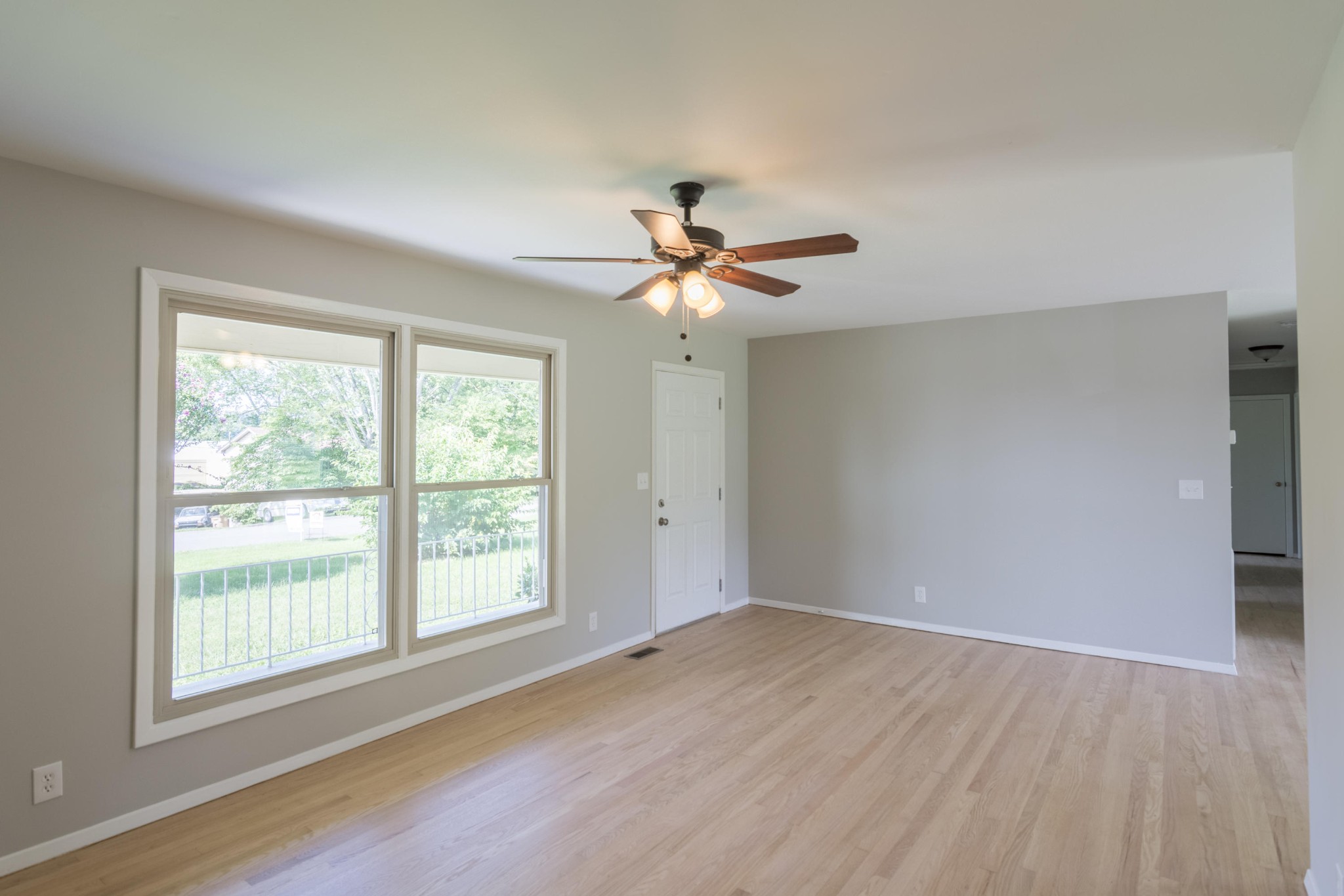 4309 Royalview Road Knoxville, TN 37921 - Photo 6 of 29 an empty room with wooden floor and windows