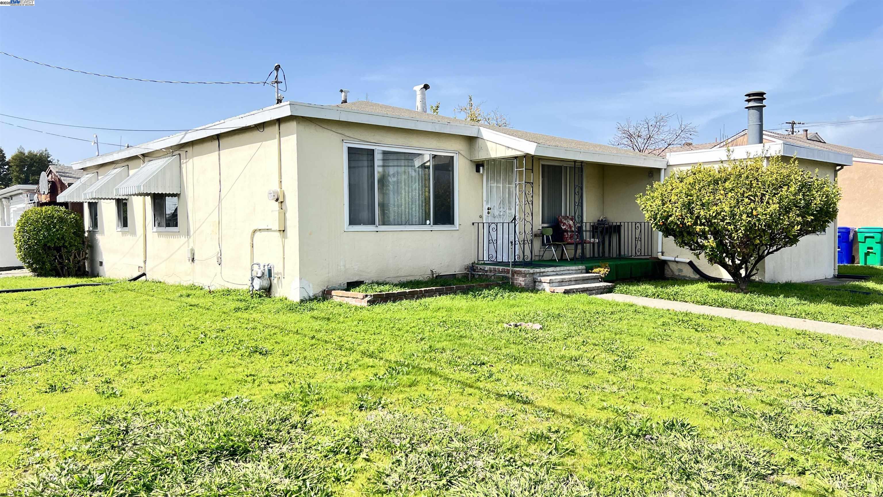 14865 Farnsworth Street San Leandro, CA 94579 - Photo 1 of 26 a front view of a house with garden