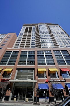 807 Davis Street, Unit 1405 Evanston, IL 60201 - Photo 1 of 12 a front view of a building with glass windows
