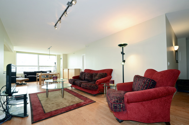 807 Davis Street, Unit 1405 Evanston, IL 60201 - Photo 2 of 12 a living room with furniture kitchen view and a large window