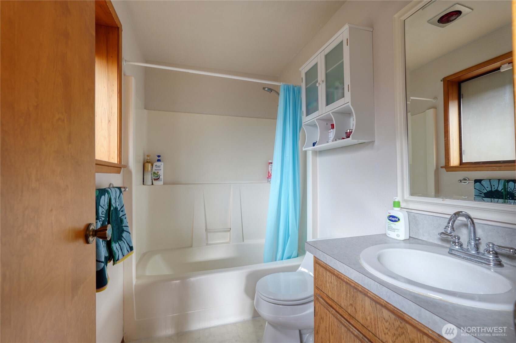 6511 255th St Court East Graham, WA 98338 - Photo 13 of 20 a bathroom with a granite countertop sink toilet a mirror and shower