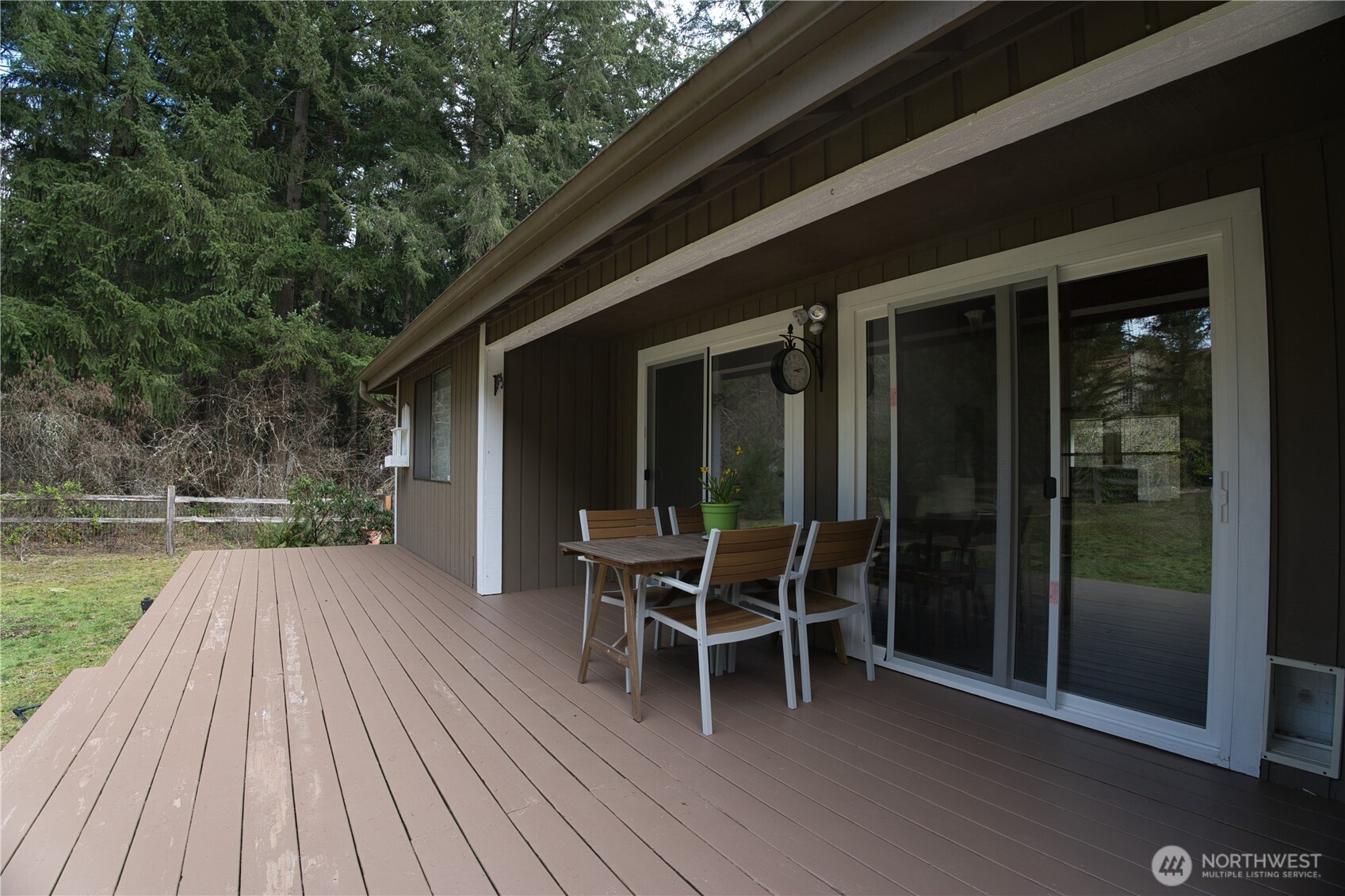 6511 255th St Court East Graham, WA 98338 - Photo 17 of 20 a outdoor view with a sitting space and large windows